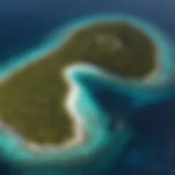 Aerial view of Meemu Atoll showcasing vibrant coral reefs