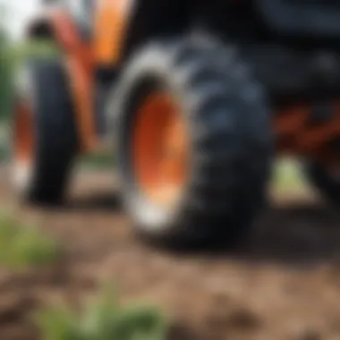 Detailed view of tracked garden tractor's undercarriage and tracks