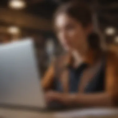 An individual reviewing staffing agency options on a laptop