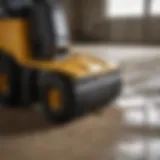 Ride-on floor scraper in action at a construction site